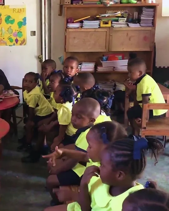 Preschool students at their tables