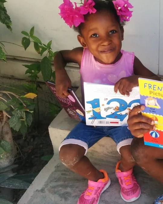 A young student reading a new library book